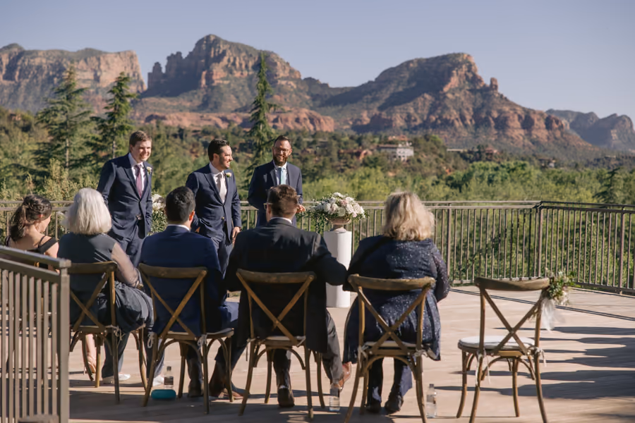 Guests seated for an outdoor ceremony with Sedona red rock formations in the background